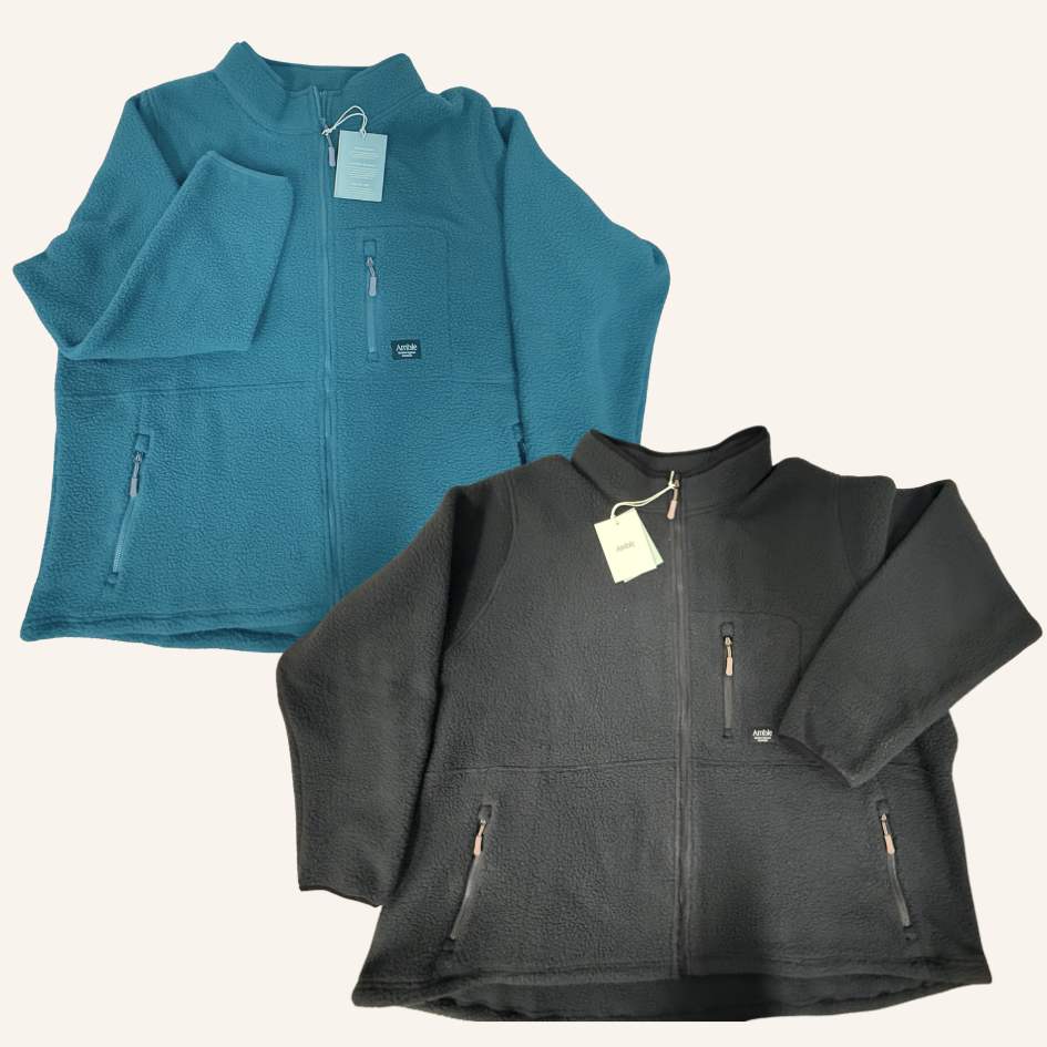 Two fleece jackets, one blue and one black, on a white background.