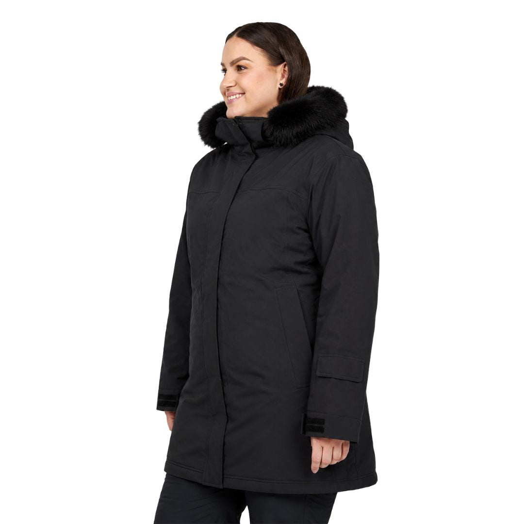 Three-quarter side profile view of a woman wearing the long-line black Brooky Long Stretch Jacket with the hood resting down.