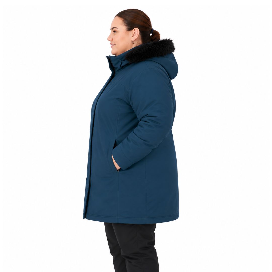 Side profile view of a woman wearing the Brooky Long Stretch Jacket in tidal blue with a black faux-fur trimmed hood.