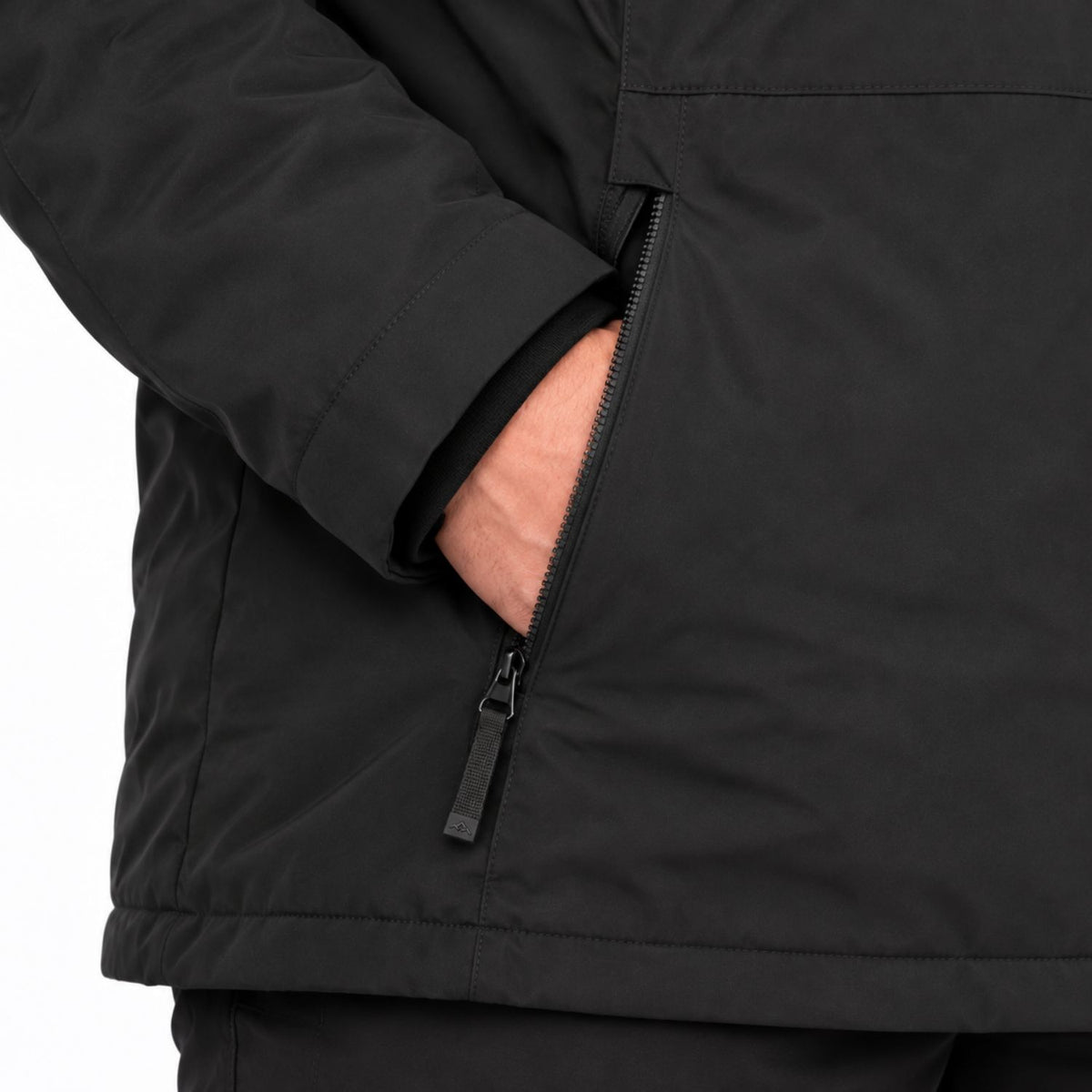 Close-up of a black jacket sleeve with a side zip pocket, showing a hand in the pocket.