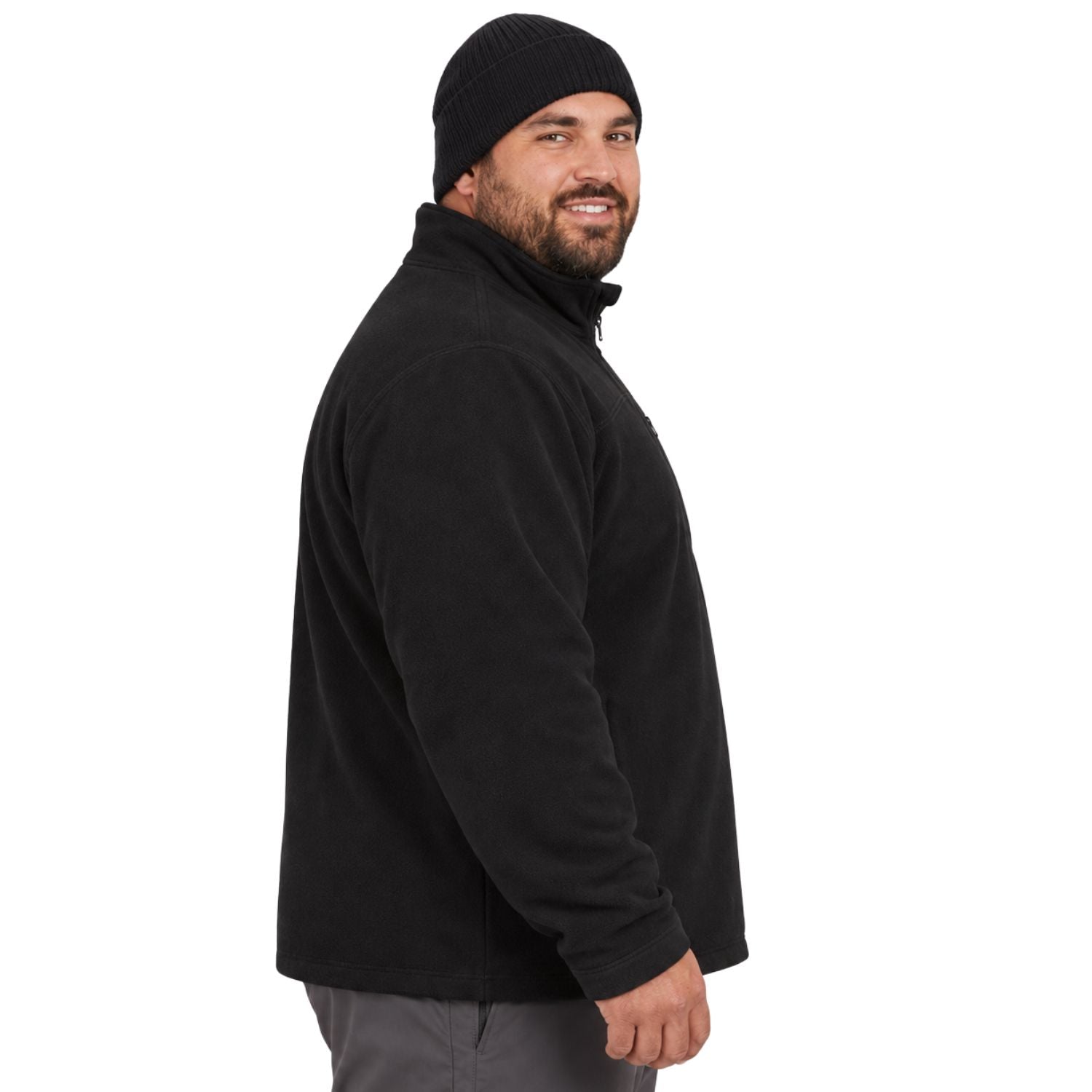 A king size man man wearing a black fleece quarter-zip pullover and a black knit beanie, shown in profile against a plain white background.