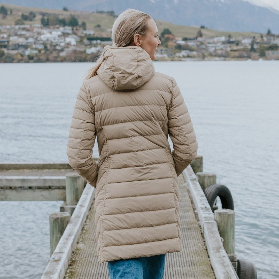 Woman wearing Plus-size Arnie Reversible Palomino Jacket facing back smiling