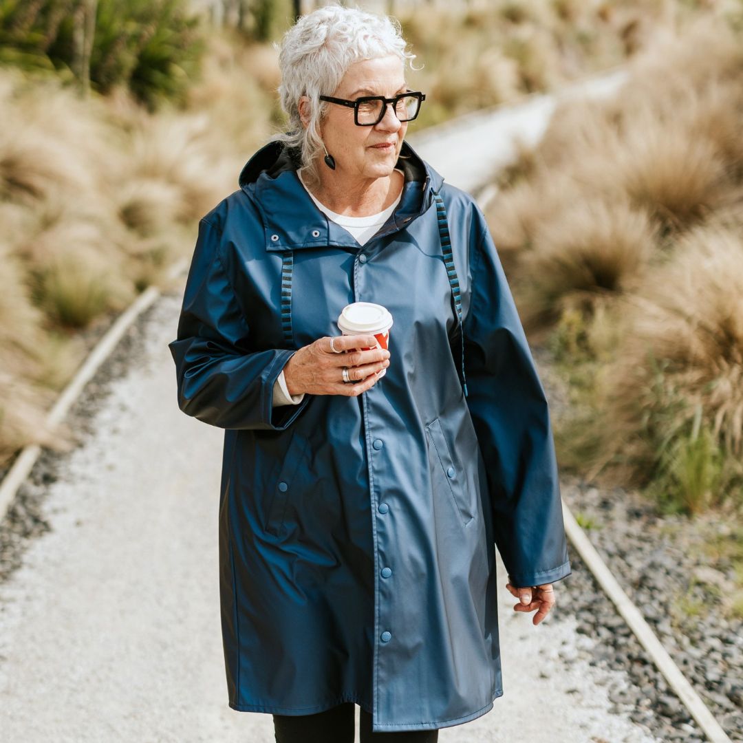 Moke Charlie Plus size woman jacket metallic blue holding a cup