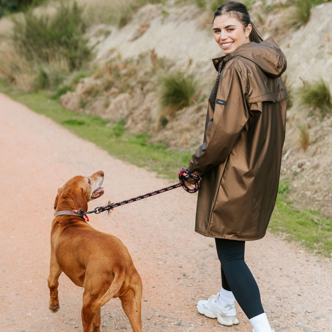 Woman Wearing Moke Charlie Women's Rain Coat Antique Gold Plus Sizes with her dog