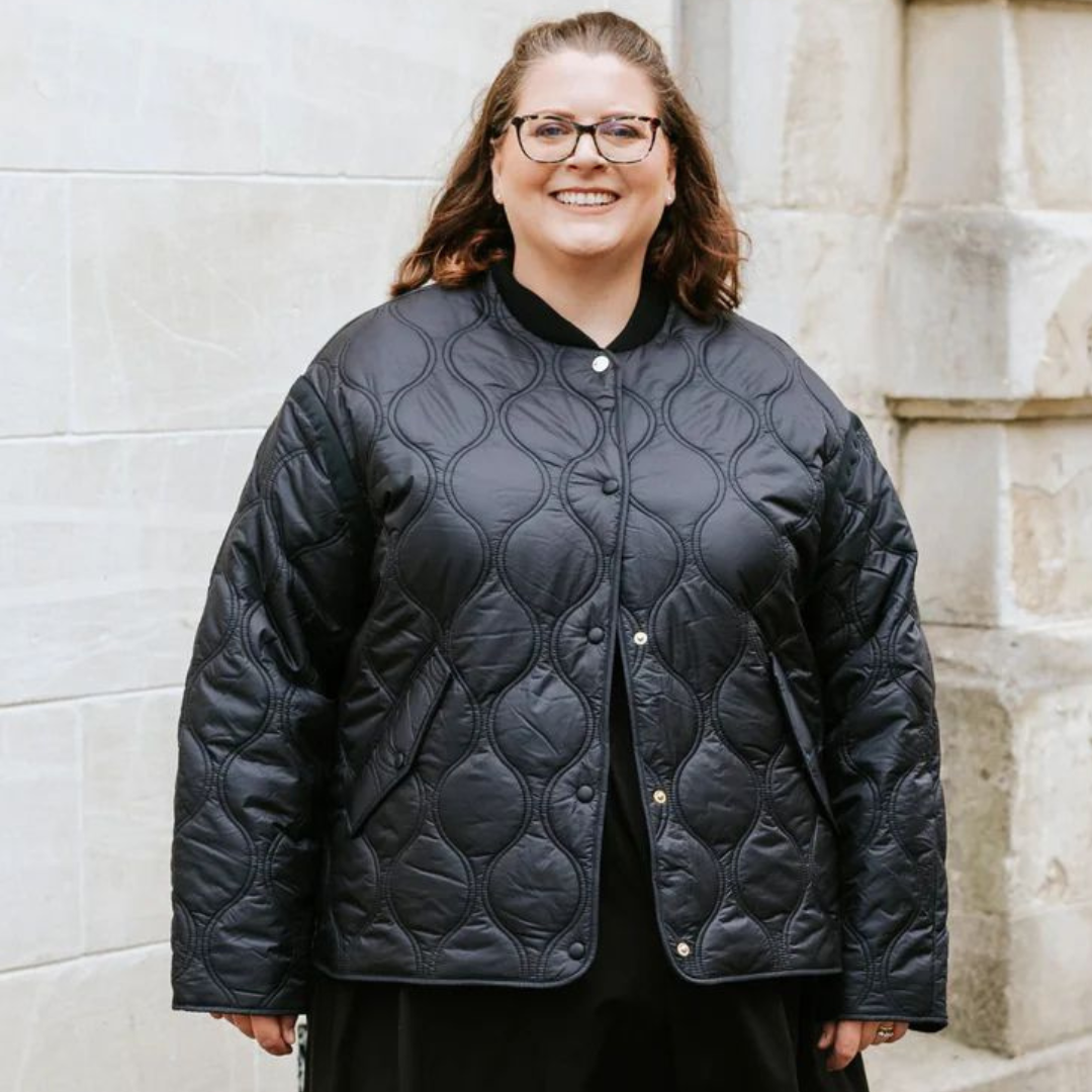 Plus size woman wearing talei bomber black