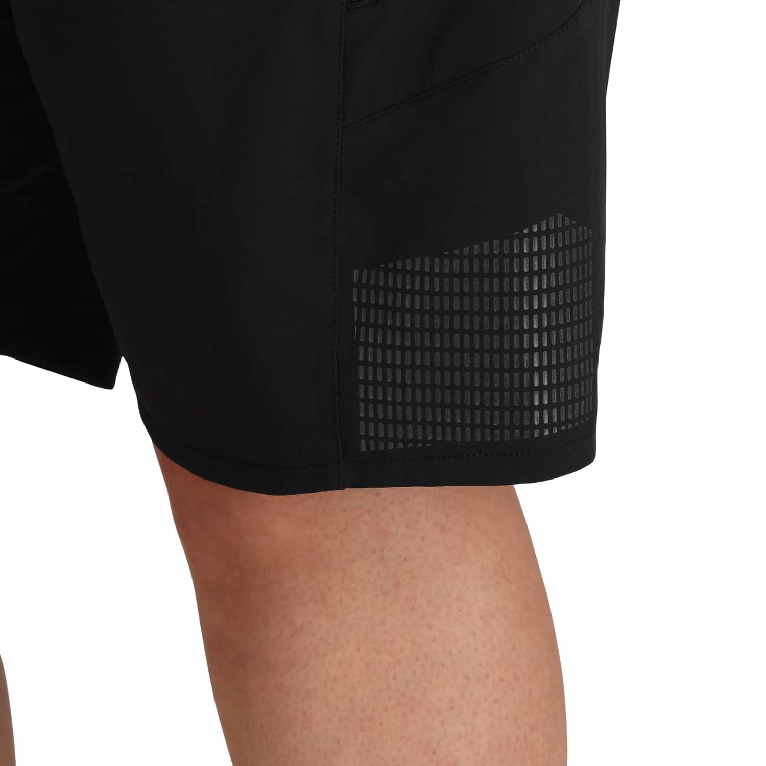 Close-up detail of Outdoor Research Freewheel Women’s Plus Size Shorts in black, highlighting reflective side panel accents and lightweight performance fabric for outdoor activity and travel.