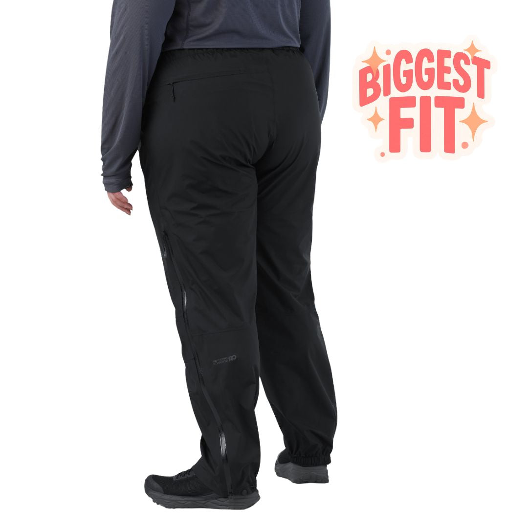 Rear three-quarter view showcasing the fit, side zippers, and elastic cuffs of the black Outdoor Research Aspire 3L Plus Size Rain Pants.
