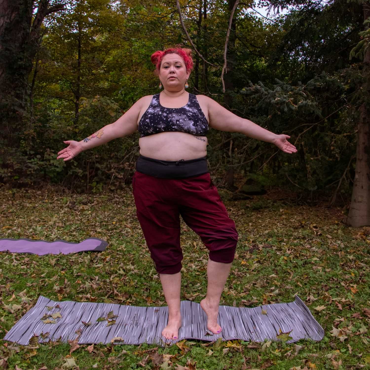 Plus size woman wearing Thicket Adventure Brecken Hiking Pants BELLY FIT during outdoor yoga.