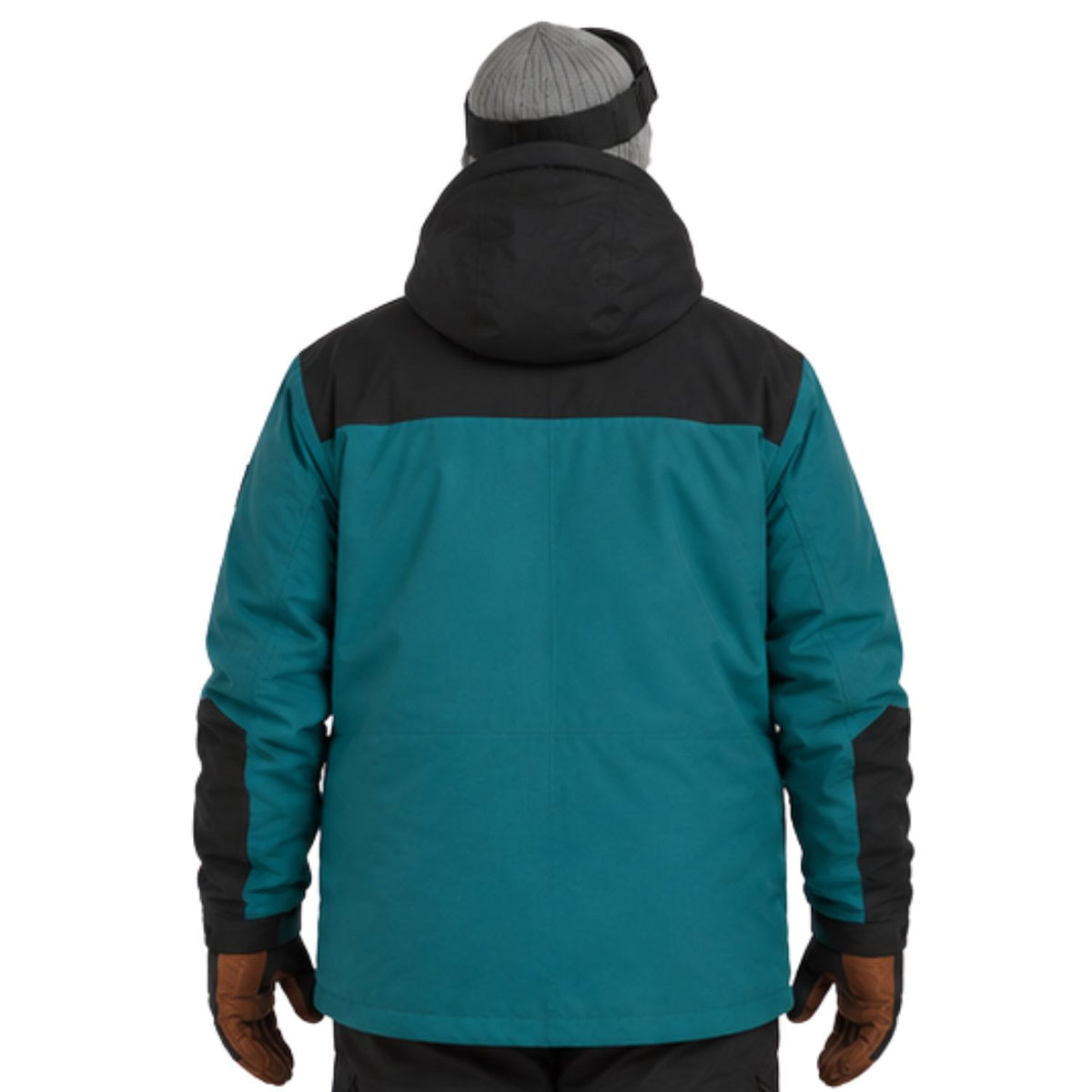 A person shown from the back wearing a colorblock winter jacket in teal and black, along with a gray beanie and brown gloves, against a plain white background.