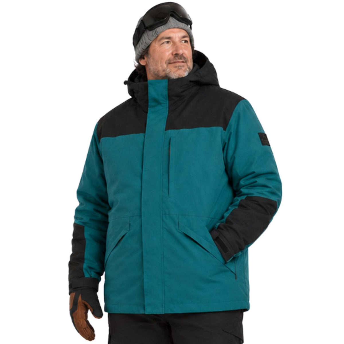 A plus size man wearing a teal and black color-blocked ski jacket, a gray beanie with goggles, and a brown glove, photographed against a solid white background.