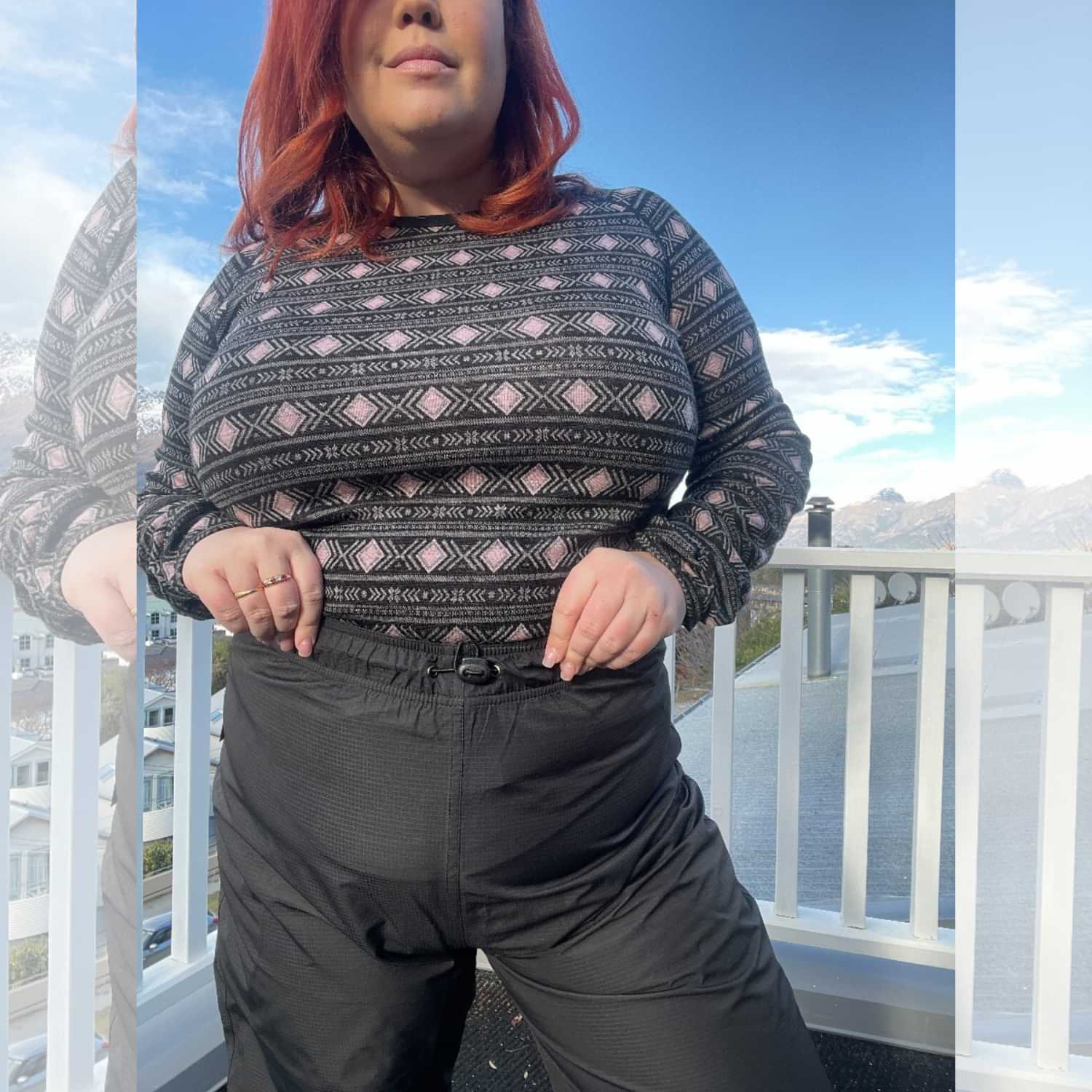 Close-up of plus size black waterproof shell rain pants waistband.