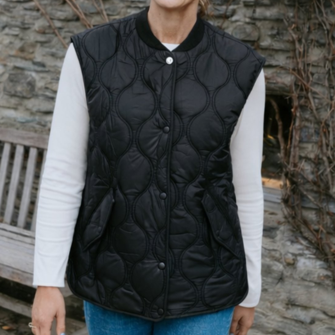Woman model wearing black neve vest color black