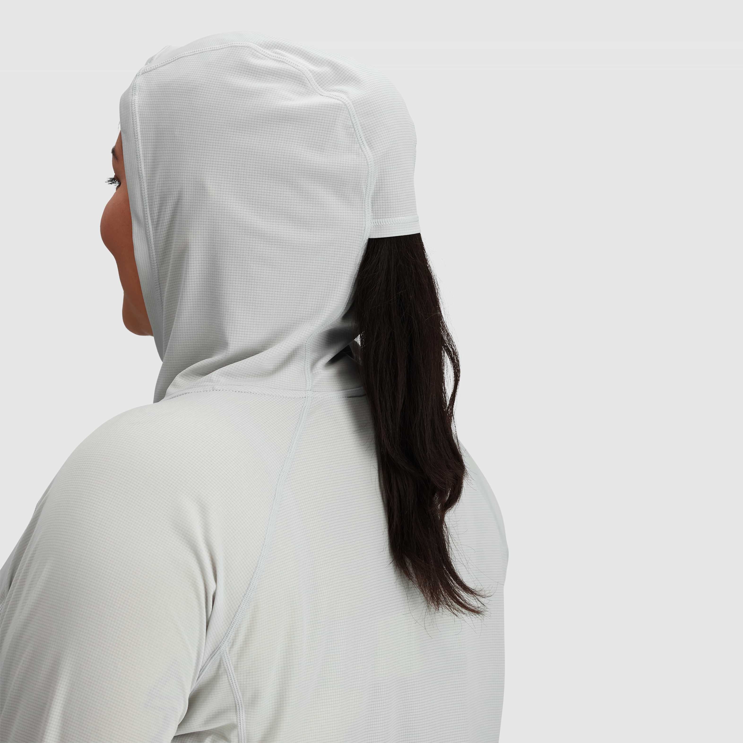 Women's wearing an echo hoodie sun shirt, showing the back of the hood