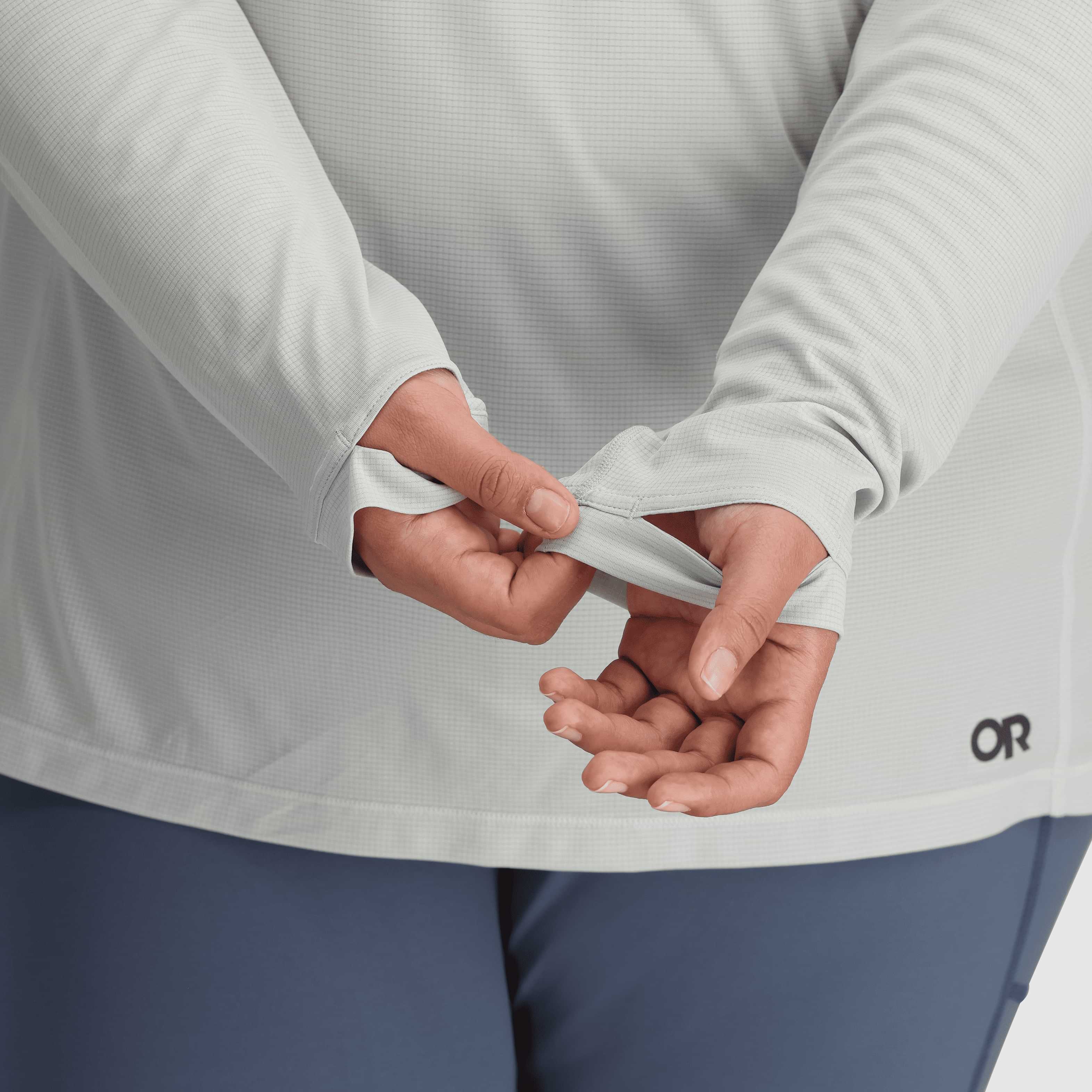 Outdoor Research Echo Hoodie Sun Shirt women’s plus size thumbhole sleeve detail in light grey fabric.
