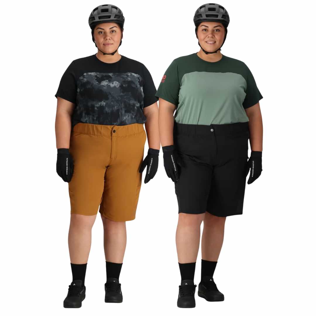 Plus size woman wearing outdoor shorts and helmet ready for biking.