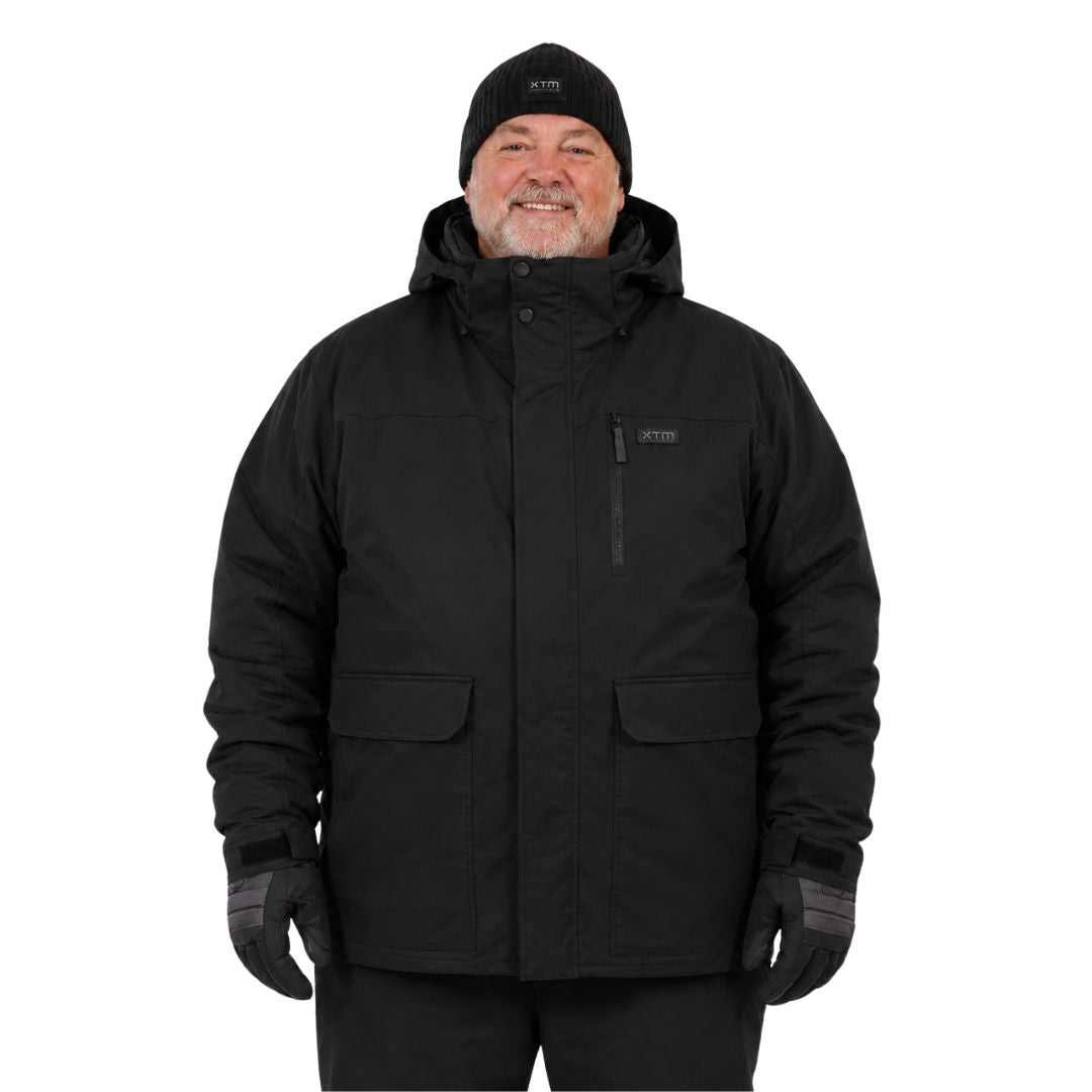 Man wearing a plus-size black winter jacket, beanie, and gloves on a white background